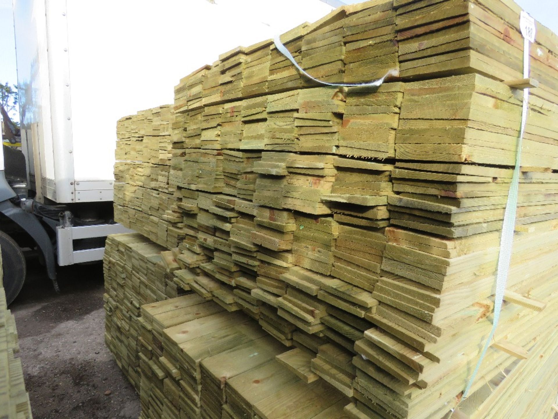 LARGE PACK OF PRESSURE TREATED FEATHER EDGE TIMBER CLADDING BOARDS. 1.65M LENGTH X 100MM WIDTH APPRO - Image 2 of 3