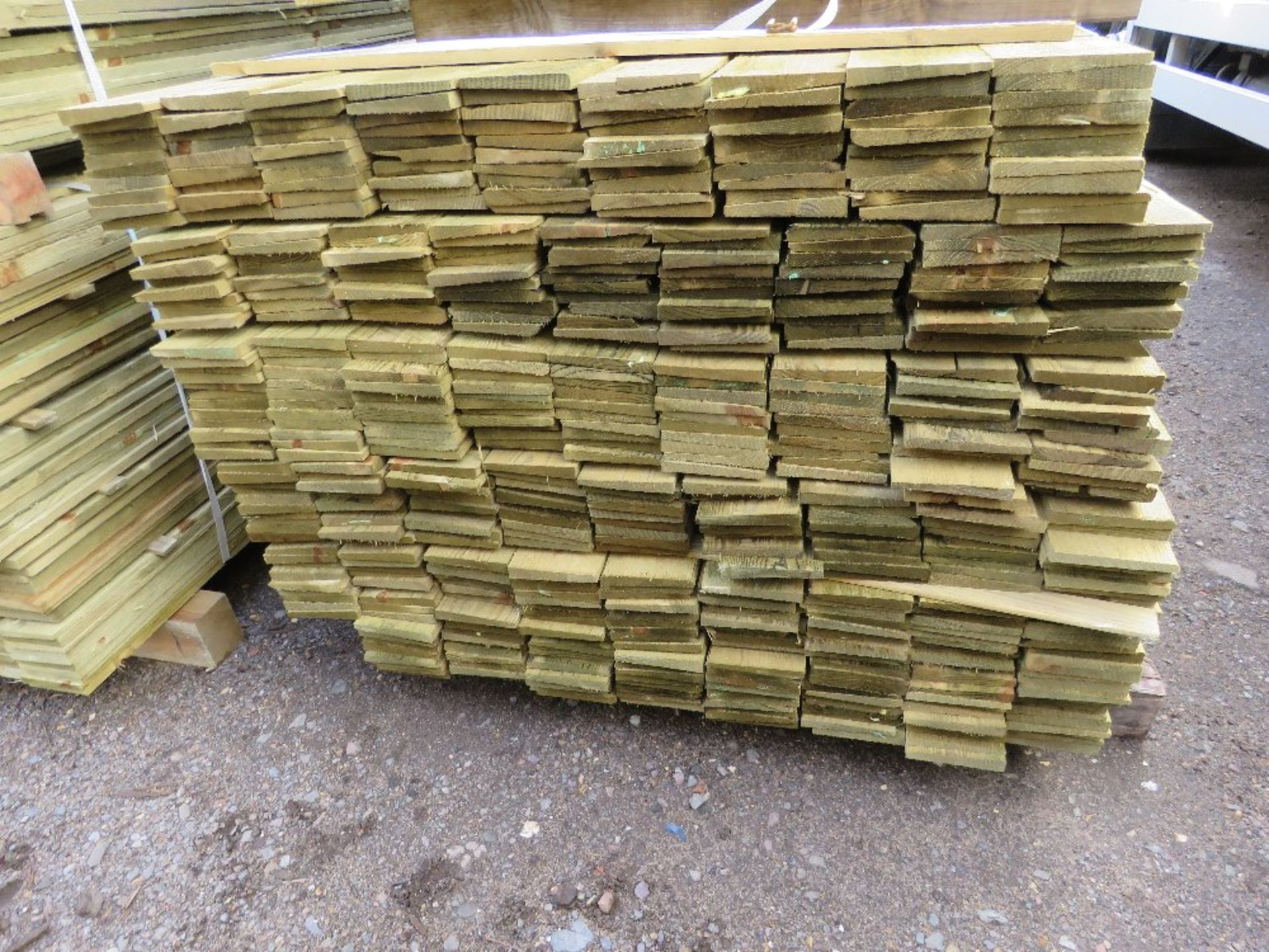 LARGE PACK OF PRESSURE TREATED FEATHER EDGE TIMBER CLADDING BOARDS. 1.60M LENGTH X 100MM WIDTH APPRO - Image 2 of 3