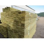 LARGE PACK OF PRESSURE TREATED FEATHER EDGE TIMBER CLADDING BOARDS. 1.80M LENGTH X 100MM WIDTH APPRO