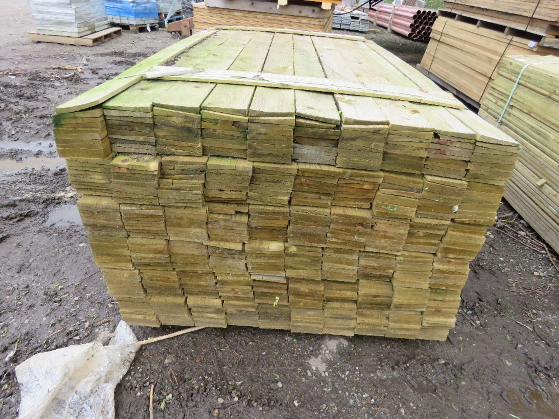 LARGE PACK OF PRESSURE TREATED FEATHER EDGE CLADDING TIMBER 1.8M LENGTH X 100MM WIDTH APPROX. - Image 2 of 3