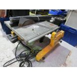 DEWALT 110VOLT SAW TABLE WITH LEGS.....THIS LOT IS SOLD UNDER THE AUCTIONEERS MARGIN SCHEME, THEREFO