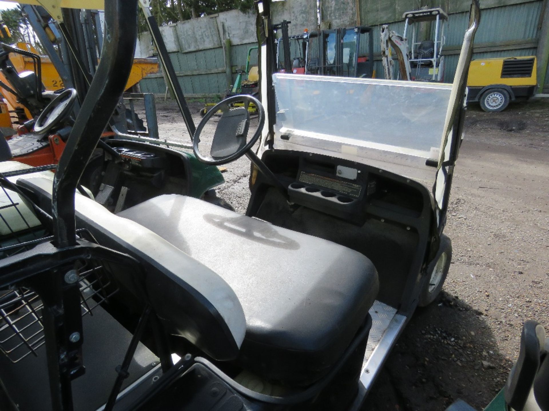 EZGO PETROL ENGINED GOLF BUGGY. BLACK COLOURED. WHEN TESTED WAS SEEN TO RUN, DRIVE, STEER AND BRAKE. - Image 5 of 7