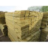 LARGE PACK OF PRESSURE TREATED FEATHER EDGE TIMBER CLADDING BOARDS. 1.50M LENGTH X 100MM WIDTH APPRO