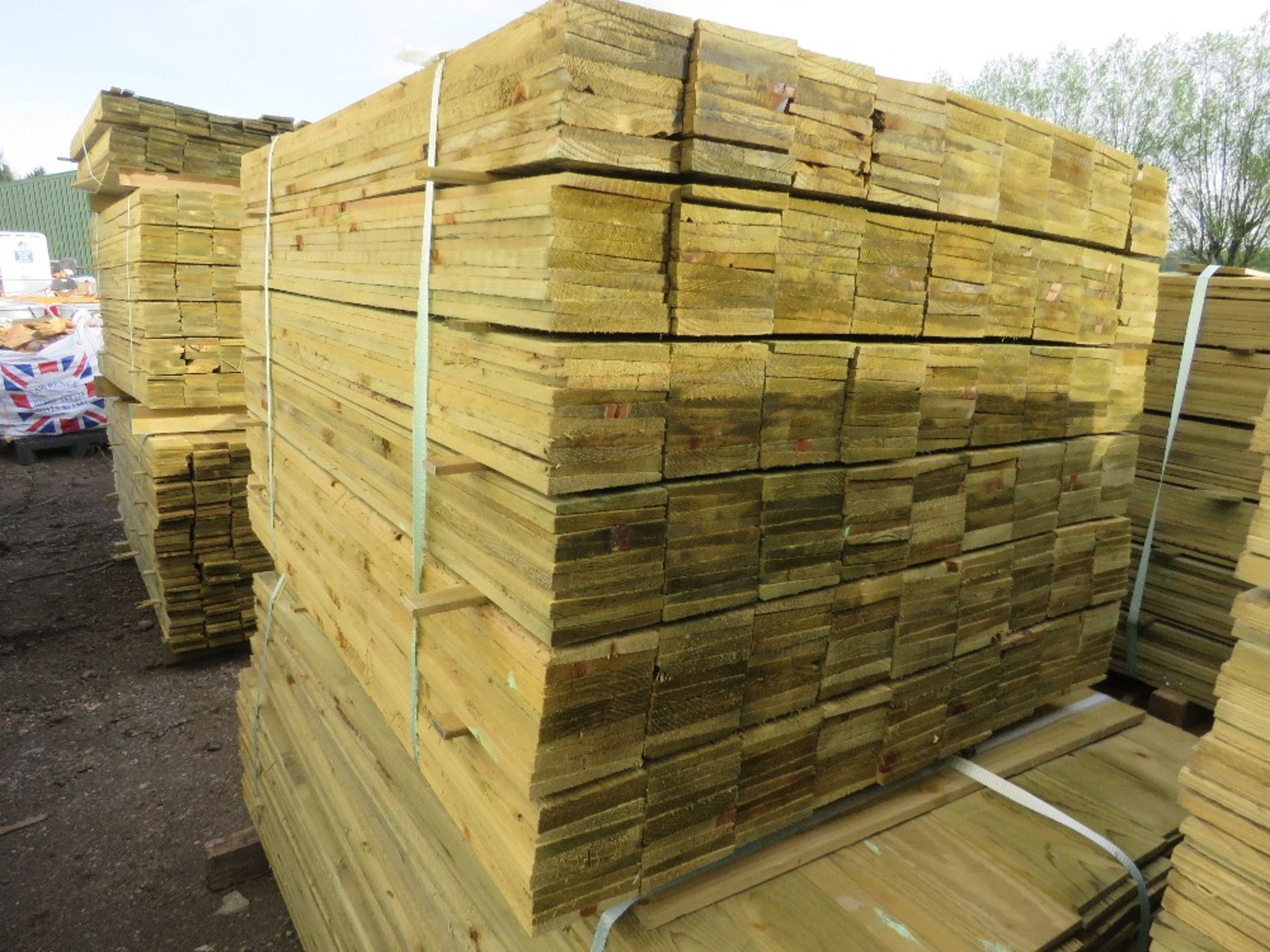 LARGE PACK OF PRESSURE TREATED FEATHER EDGE TIMBER CLADDING BOARDS. 1.20M LENGTH X 100MM WIDTH APPRO
