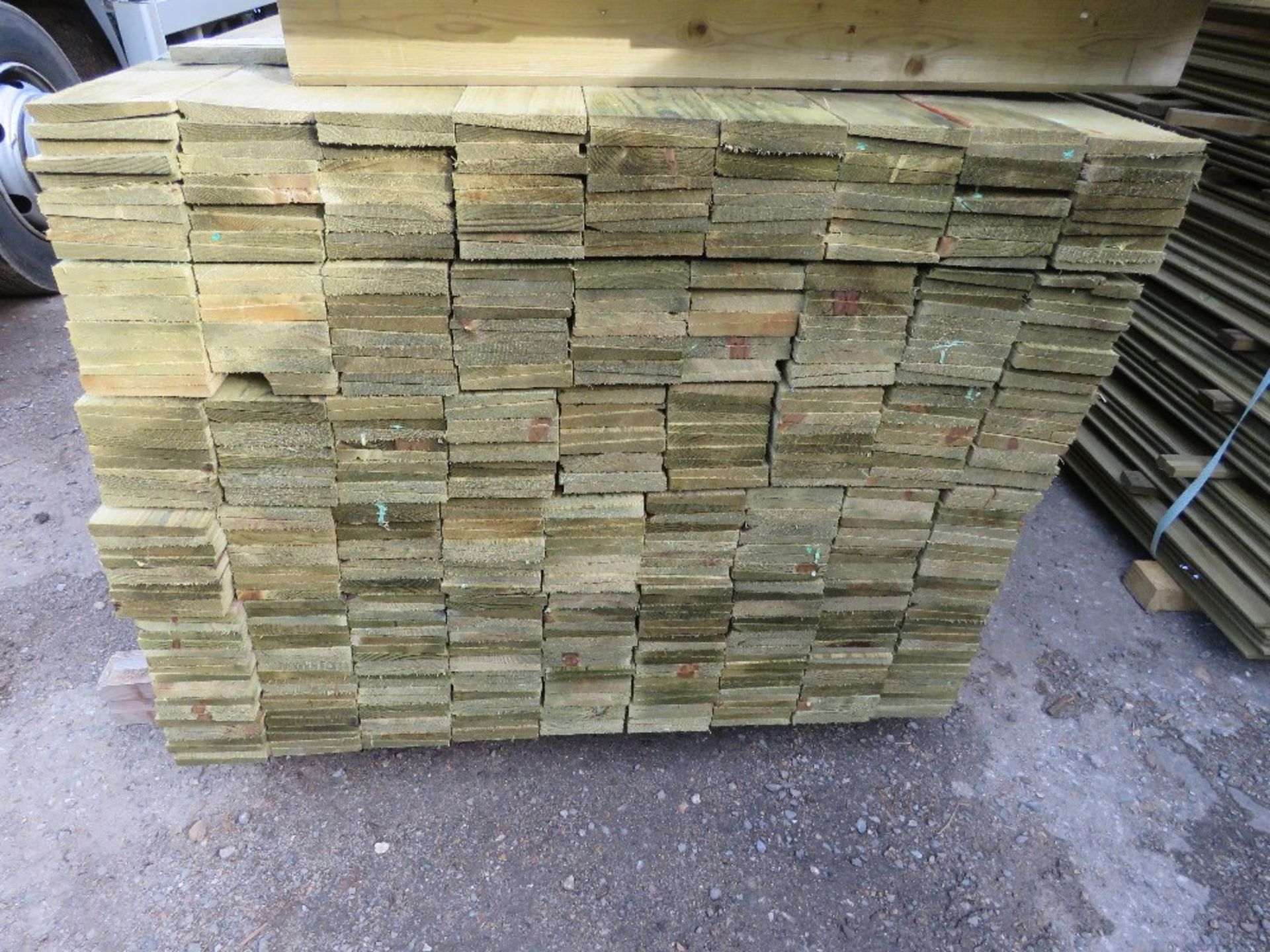 LARGE PACK OF PRESSURE TREATED FEATHER EDGE TIMBER CLADDING BOARDS. 1.80M LENGTH X 100MM WIDTH APPRO - Image 2 of 3