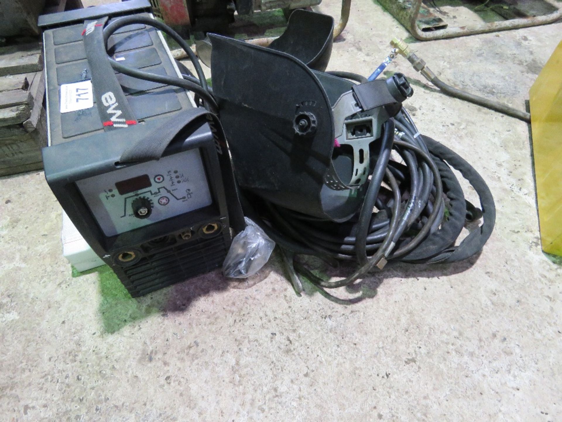 EWN P200 PICOTIG MV WELDER, 110VOLT WITH RODS PLUS 2 X HELMETS AS SHOWN.....THIS LOT IS SOLD UNDER T