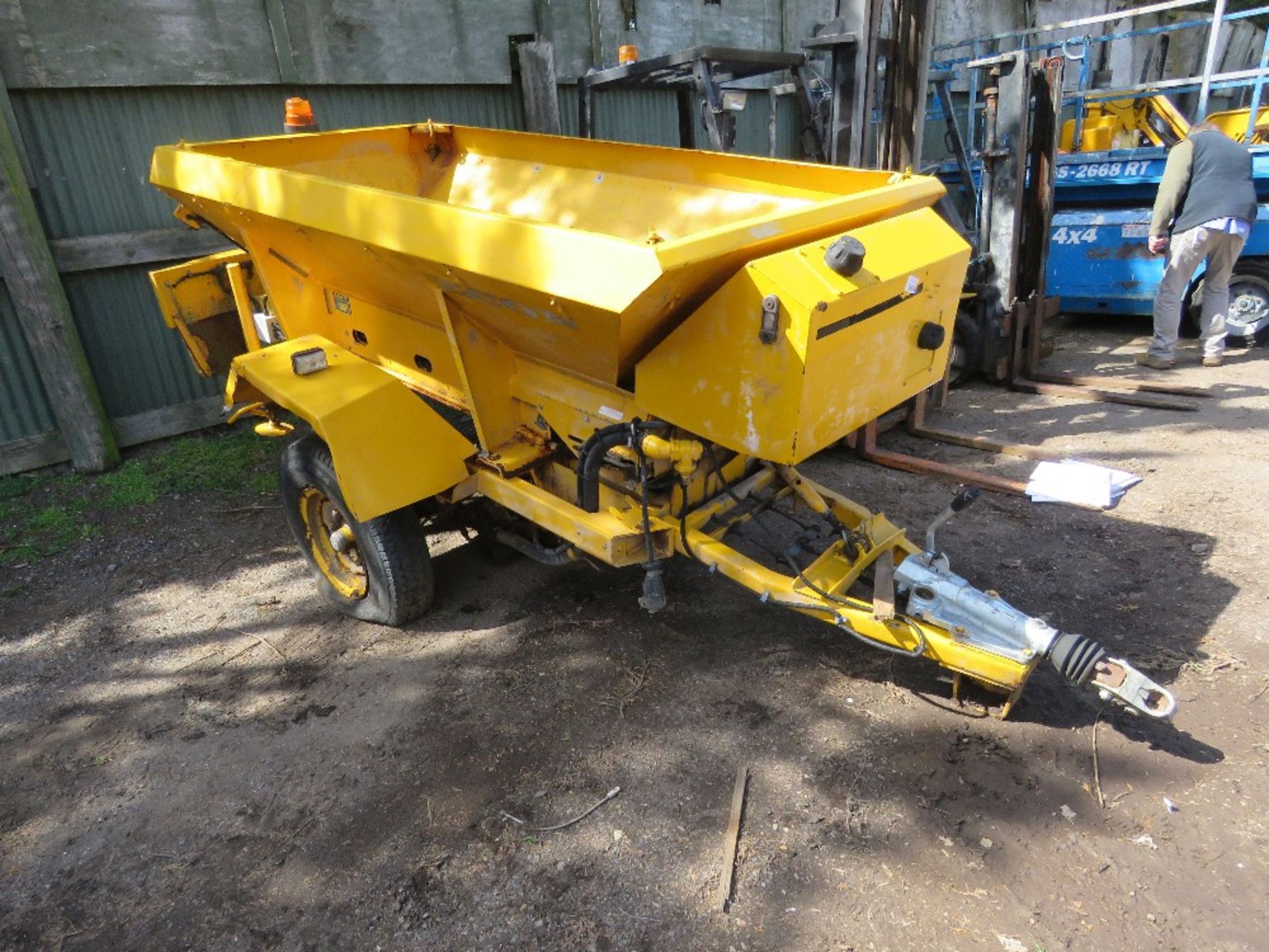 CHARITY LOT!! ECON SINGLE AXLED TOWED SALT SPREADER WITH WHEEL DRIVEN HYDRAULIC SYSTEM. UNUSED FOR