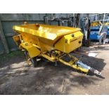 CHARITY LOT!! ECON SINGLE AXLED TOWED SALT SPREADER WITH WHEEL DRIVEN HYDRAULIC SYSTEM. UNUSED FOR