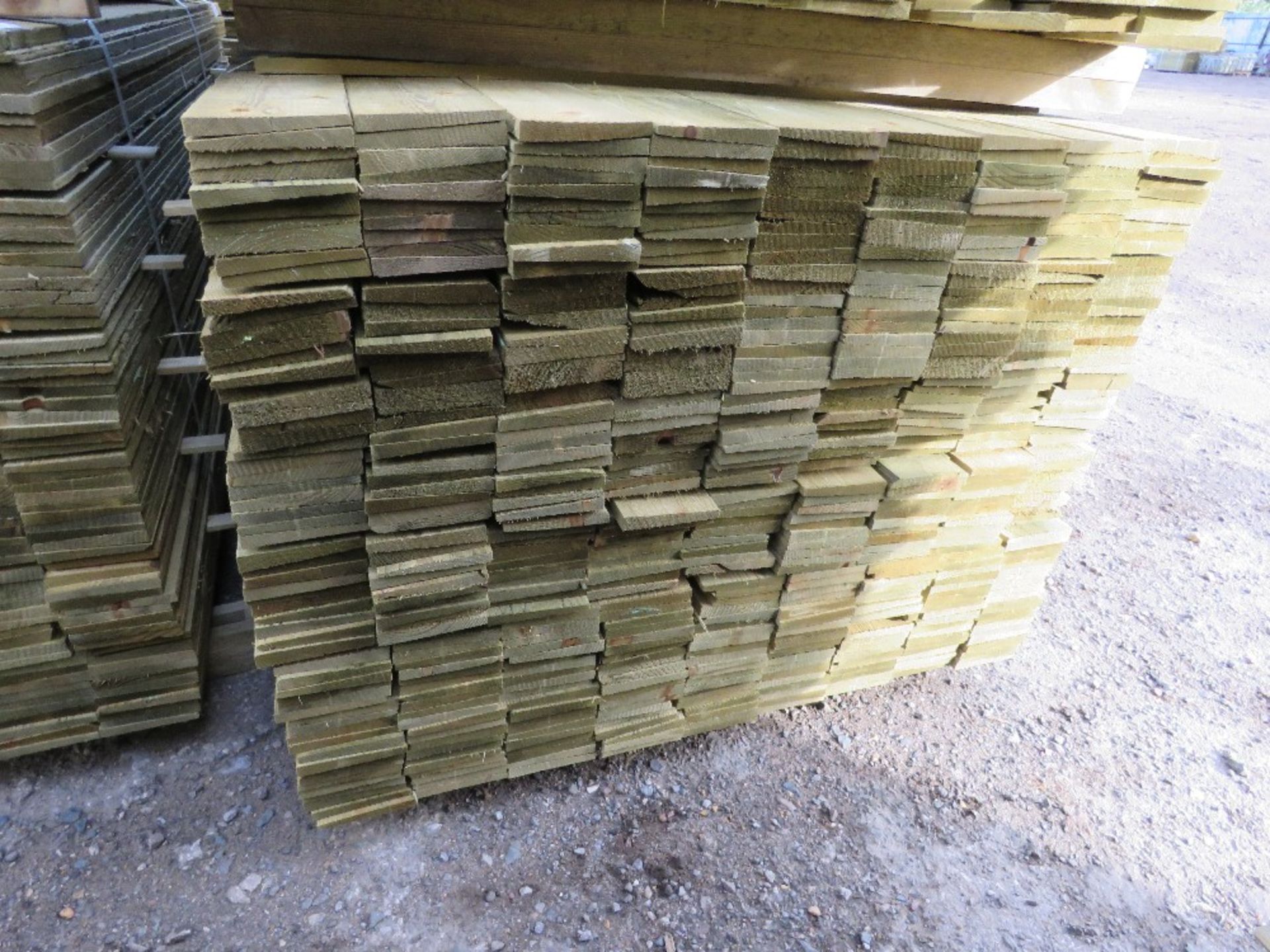 LARGE PACK OF PRESSURE TREATED FEATHER EDGE TIMBER CLADDING BOARDS. 1.80M LENGTH X 100MM WIDTH APPRO - Image 2 of 3