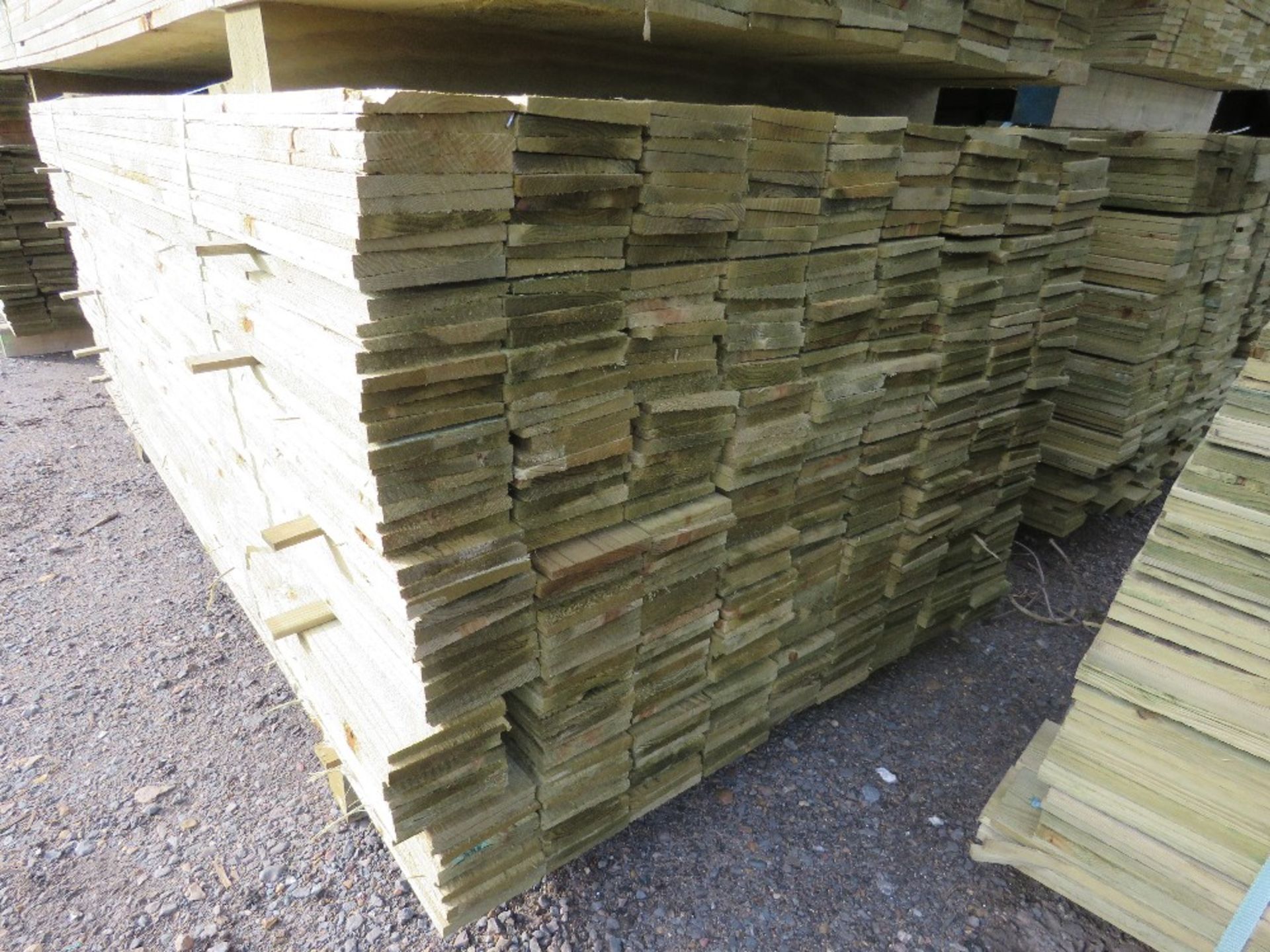 LARGE PACK OF PRESSURE TREATED FEATHER EDGE TIMBER CLADDING BOARDS. 1.80M LENGTH X 100MM WIDTH APPRO