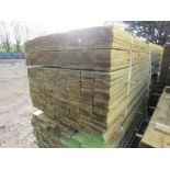 LARGE PACK OF PRESSURE TREATED FEATHER EDGE TIMBER CLADDING BOARDS. 1.80M LENGTH X 100MM WIDTH APPRO