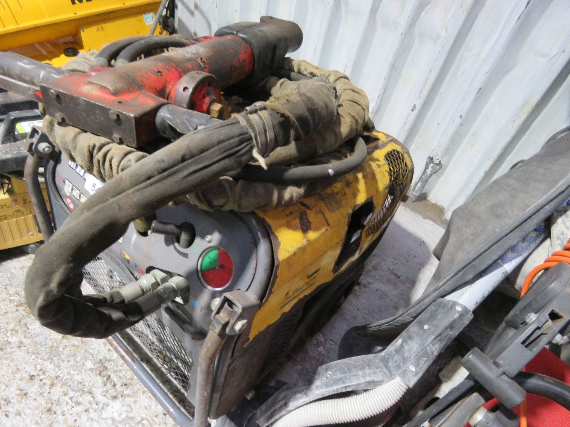 ATLAS COPCO HYDRAULIC BREAKER PACK WITH HOSE AND GUN.