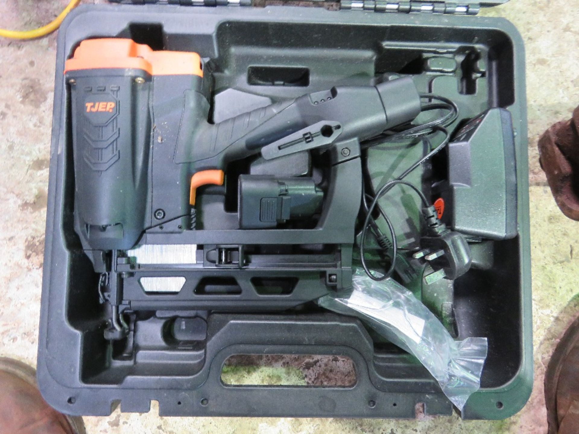 GAS NAILER GUN IN A CASE.