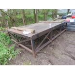 EXTRA LARGE HEAVY DUTY STEEL FACED WORK TABLE. 12FT X 8FT APPROX WITH WORK HEIGHT OF 0.85M APPROX.