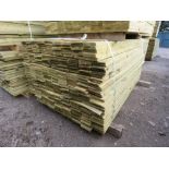 LARGE PACK OF PRESSURE TREATED FEATHER EDGE TIMBER CLADDING BOARDS. 1.60M LENGTH X 100MM WIDTH APPRO