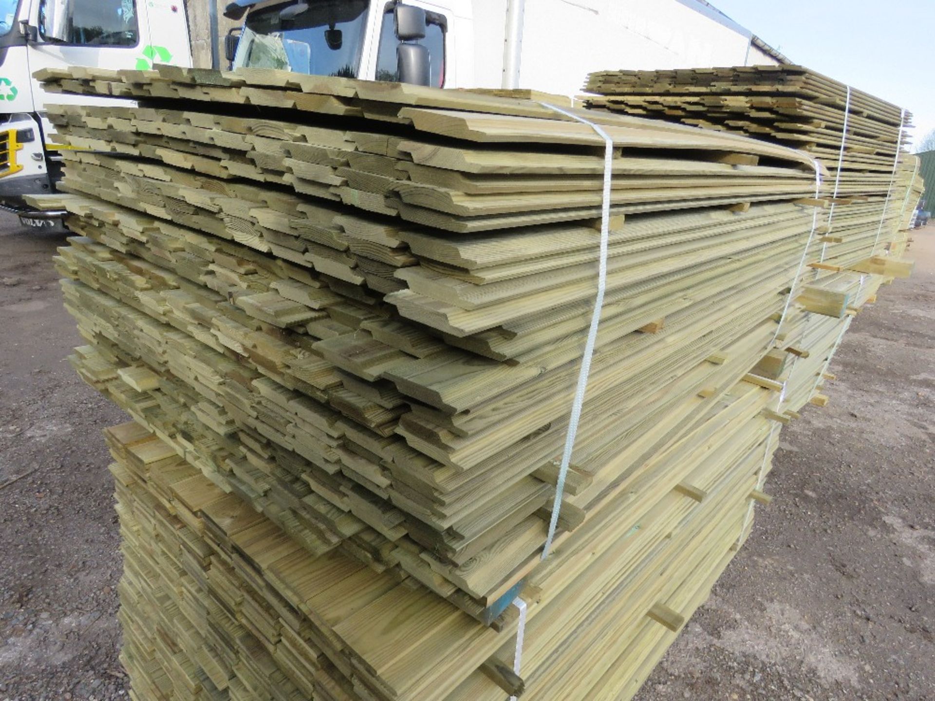 LARGE PACK OF PRESSURE TREATED SHIPLAP TYPE TIMBER CLADDING BOARDS. 1.73M LENGTH X 100MM WIDTH APPRO