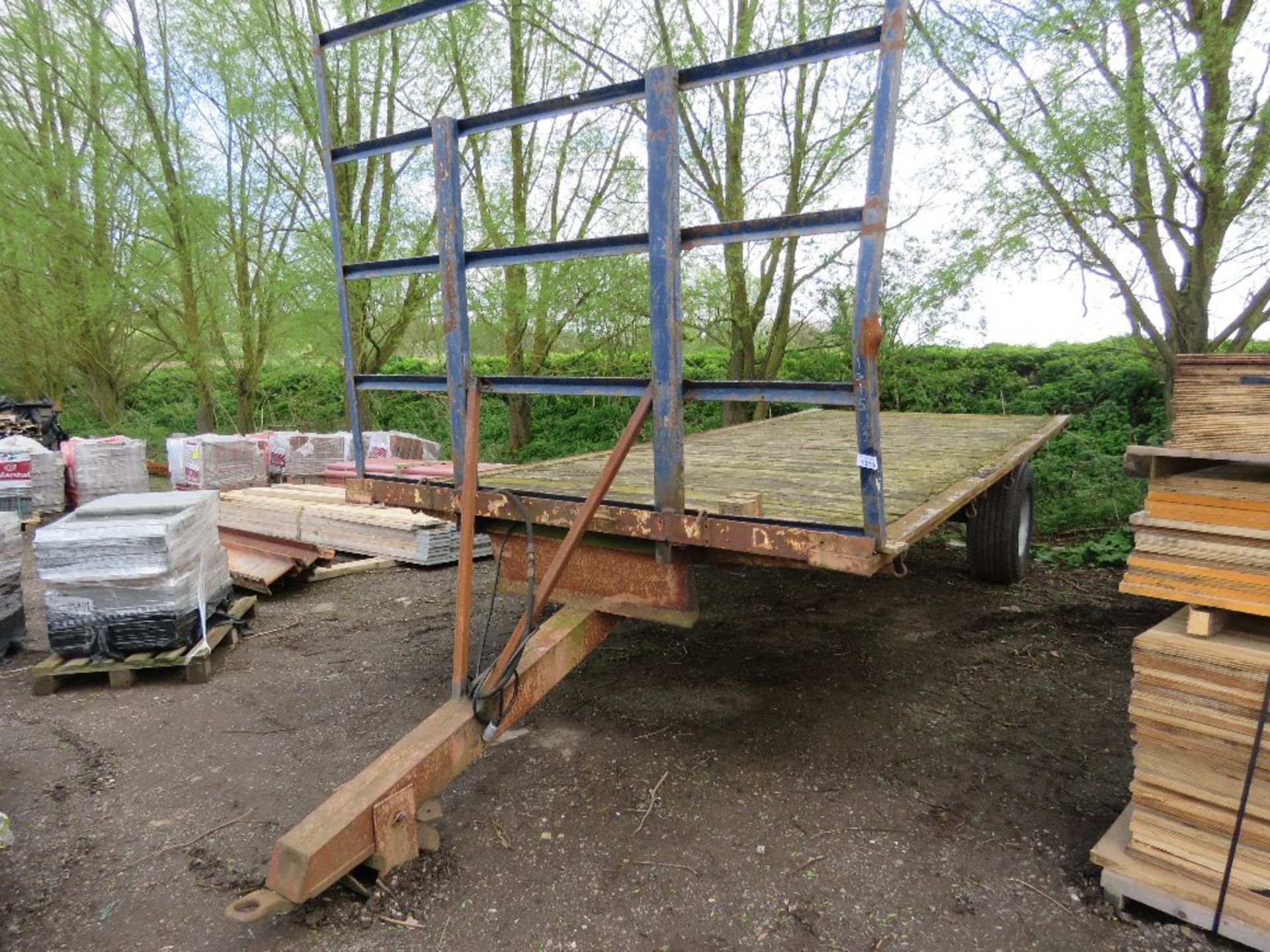 SINGLE AXLED FLAT BED BALE TRAILER, 20FT X 8FT BED APPROX ON SUPER SINGLE WHEELS.....THIS LOT IS SOL