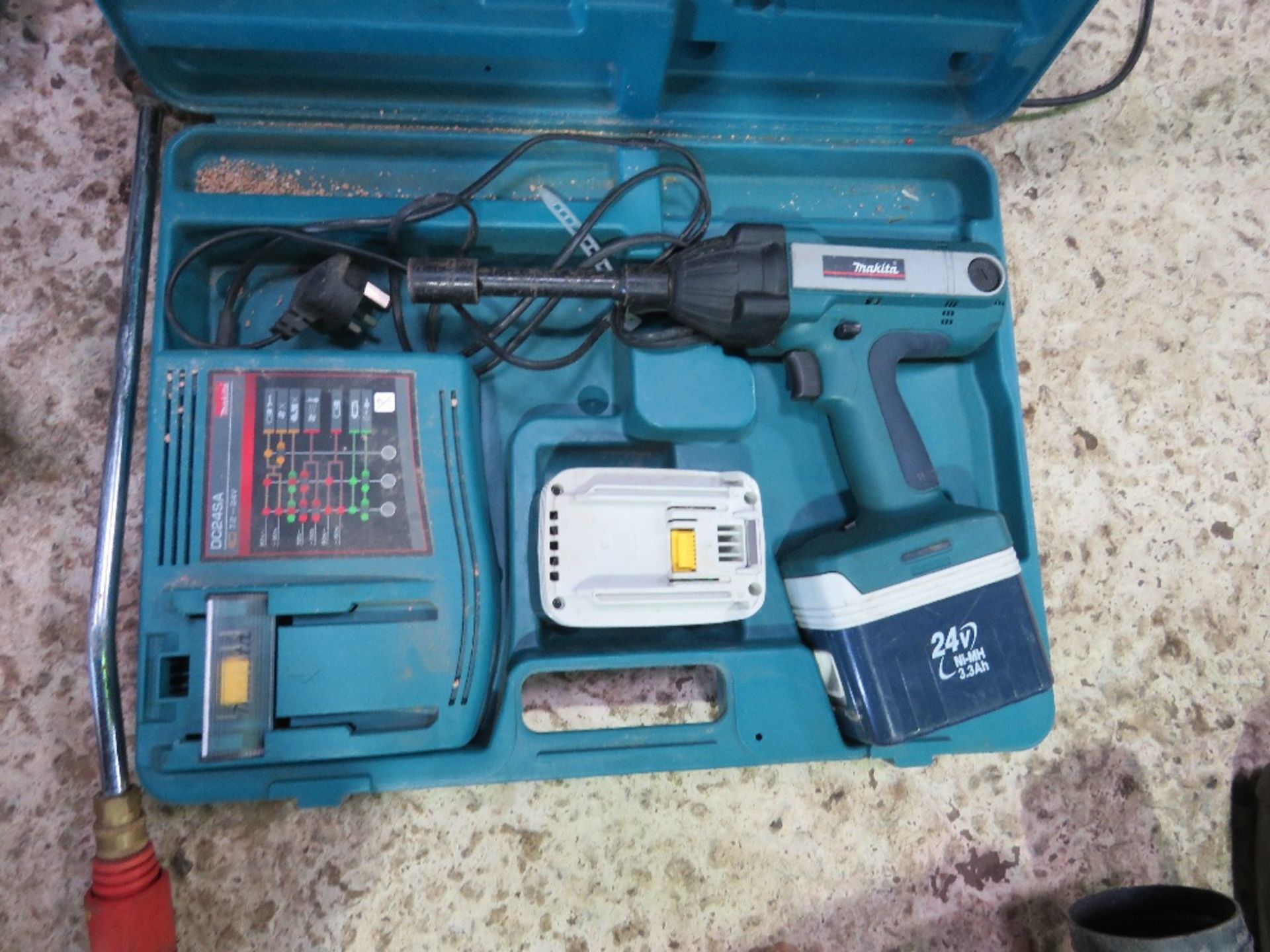 MAKITA 24VOLT BATTERY NUT DRIVER IN A CASE.