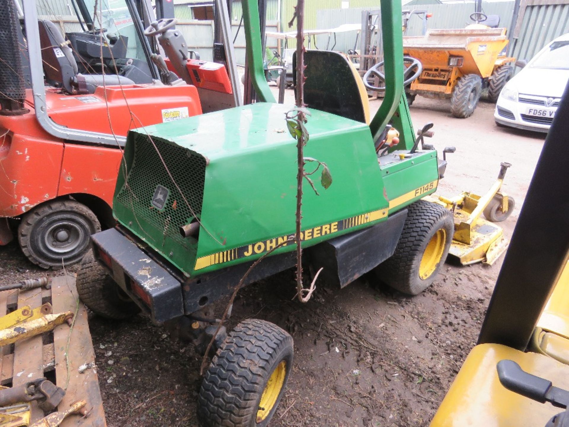 JOHN DEERE 1145 4WD OUT FRONT ROTARY MOWER. WHEN TESTED WAS SEEN TO START, RUN, DRIVE AND MOWER ENGA - Image 6 of 11