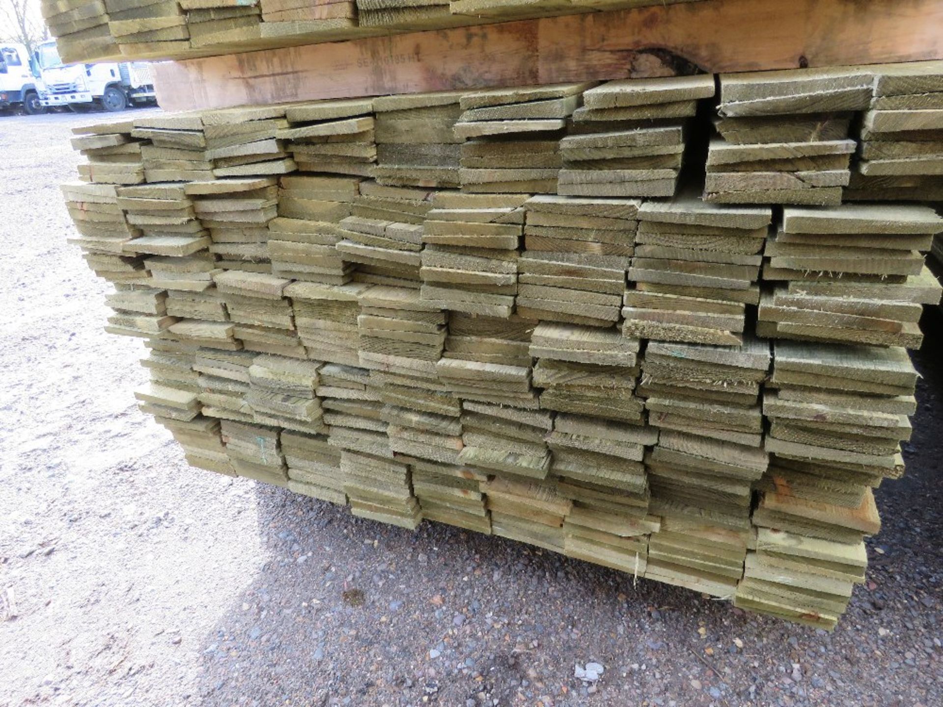 LARGE PACK OF PRESSURE TREATED FEATHER EDGE TIMBER CLADDING BOARDS. 1.80M LENGTH X 100MM WIDTH APPRO - Image 2 of 3