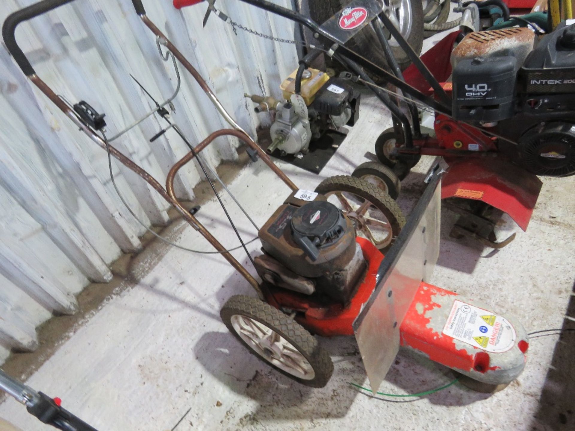 WHEELED STRIMMER.OWNER MOVING HOUSE.....THIS LOT IS SOLD UNDER THE AUCTIONEERS MARGIN SCHEME, THEREF