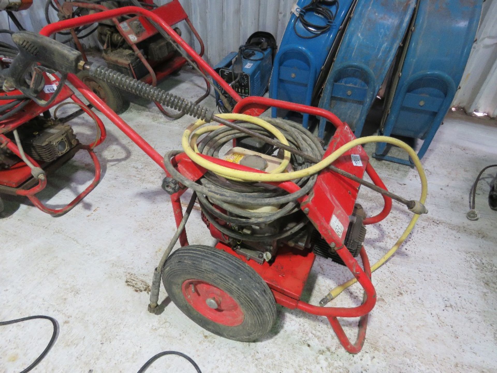 PETROL ENGINED PRESSURE WASHER WITH HOSE AND LANCE.