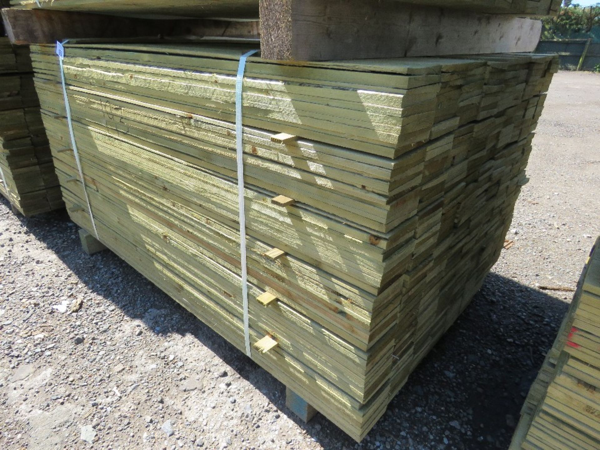 LARGE PACK OF PRESSURE TREATED FEATHER EDGE CLADDING TIMBER BOARDS 1.5M LENGTH X 100MM WIDTH APPROX.