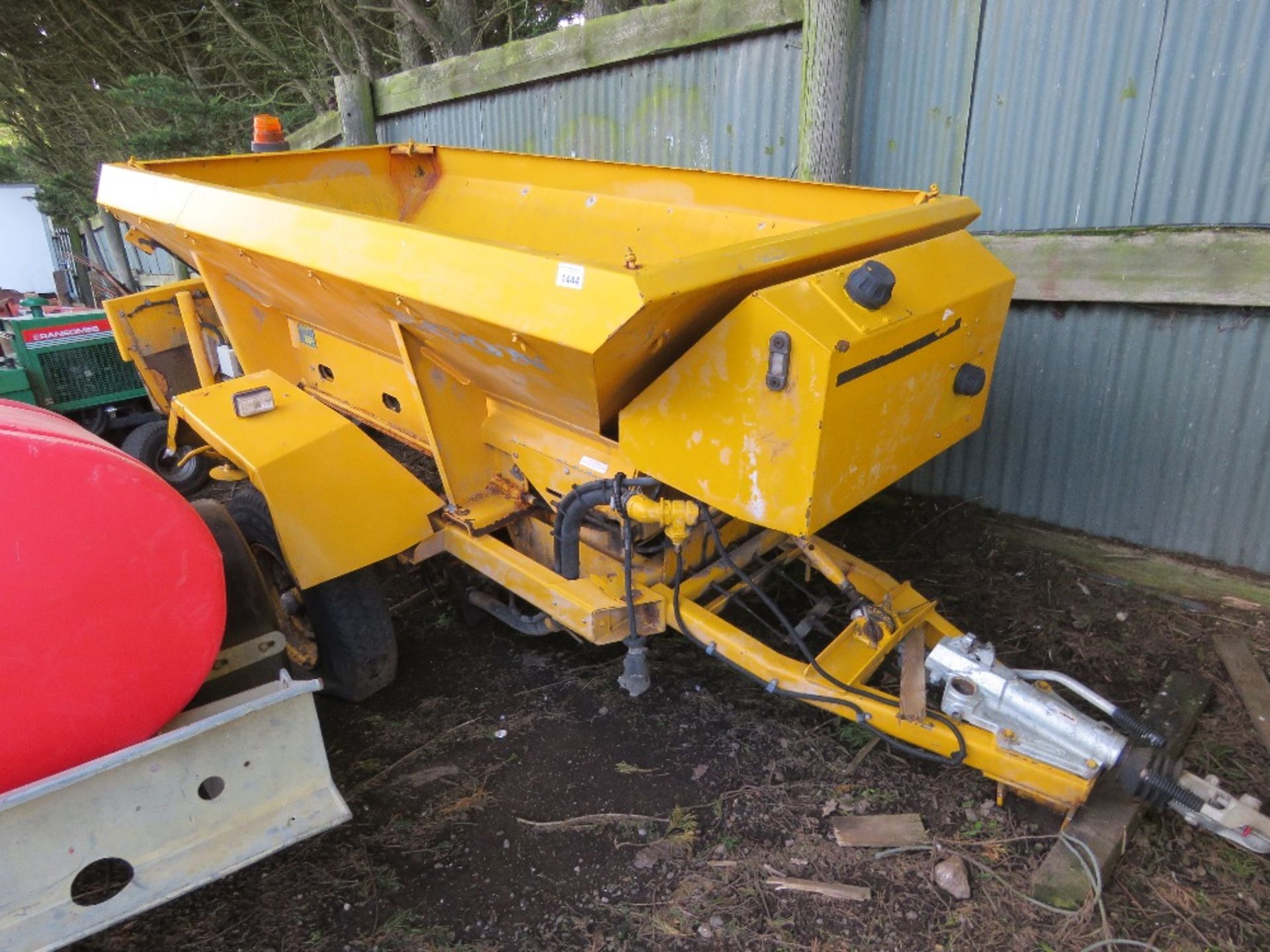 CHARITY LOT!! ECON SINGLE AXLED TOWED SALT SPREADER WITH WHEEL DRIVEN HYDRAULIC SYSTEM. UNUSED FOR