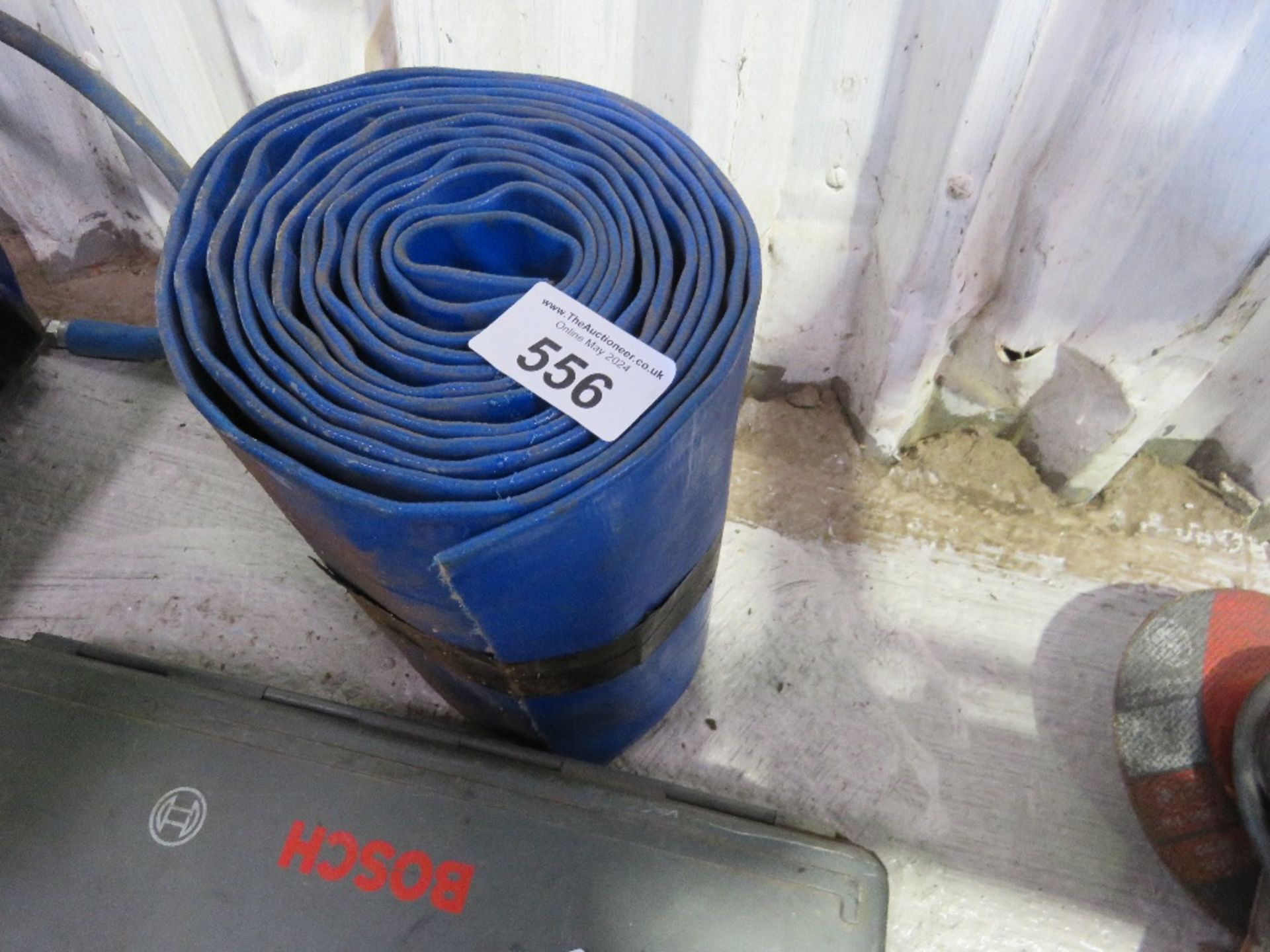 ROLL OF LAREG BORE LAY FLAT HOSE.....THIS LOT IS SOLD UNDER THE AUCTIONEERS MARGIN SCHEME, THEREFORE