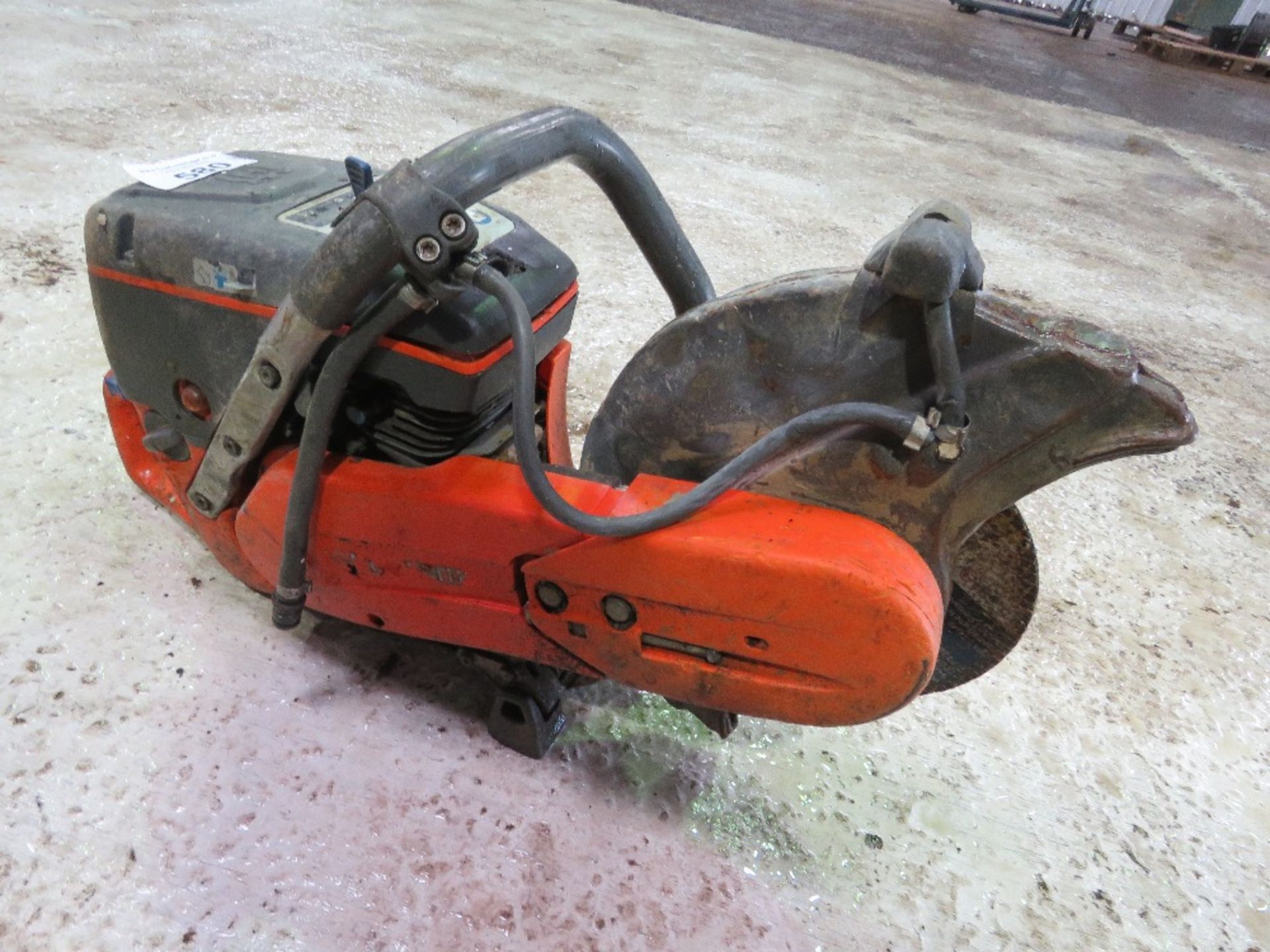 HUSQVARNA PETROL ENGINED CUT OFF SAW....THIS LOT IS SOLD UNDER THE AUCTIONEERS MARGIN SCHEME, THEREF