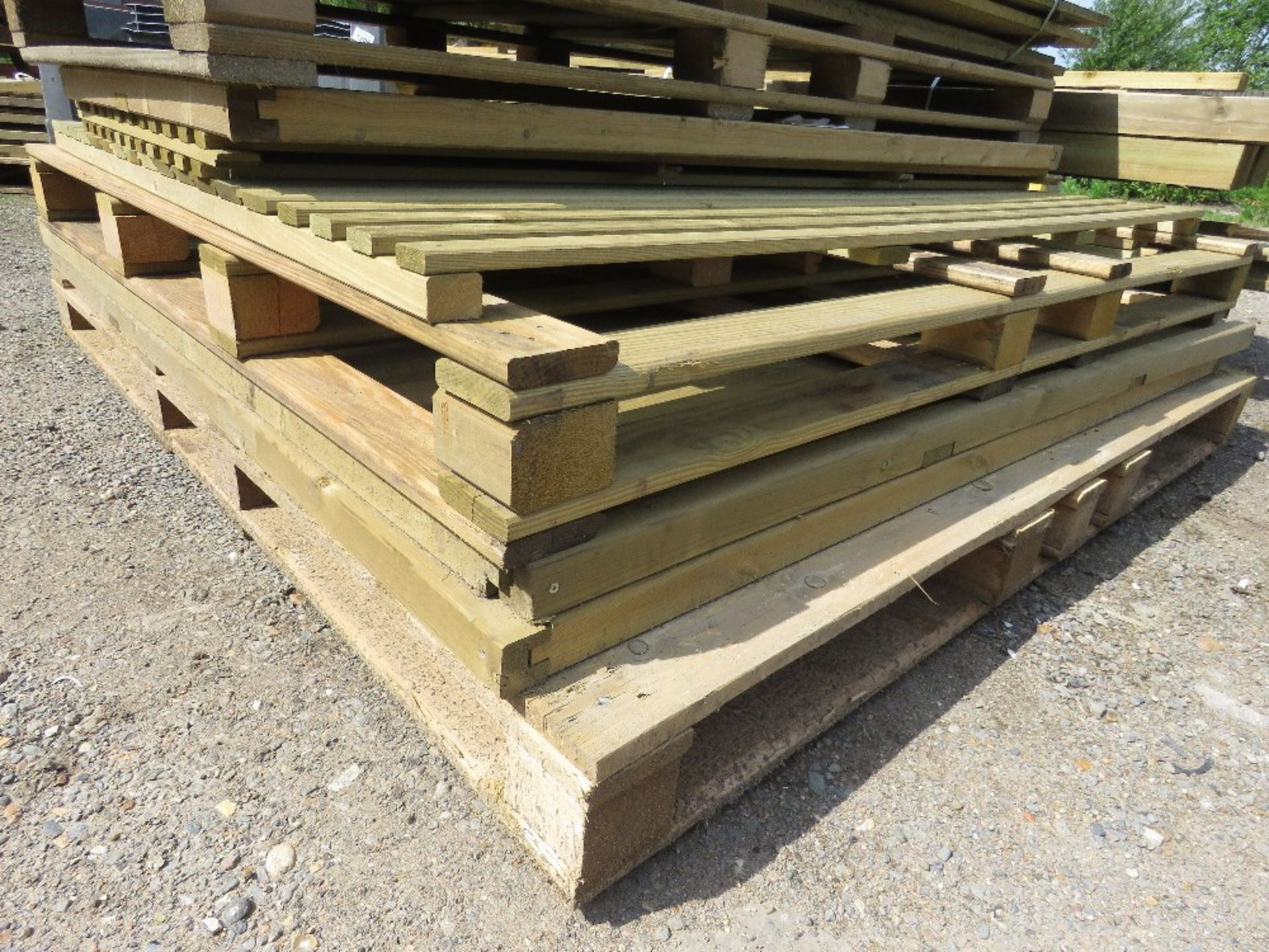 STACK OF ASSORTED FENCE PANELS AND TIMBERS AS SHOWN.