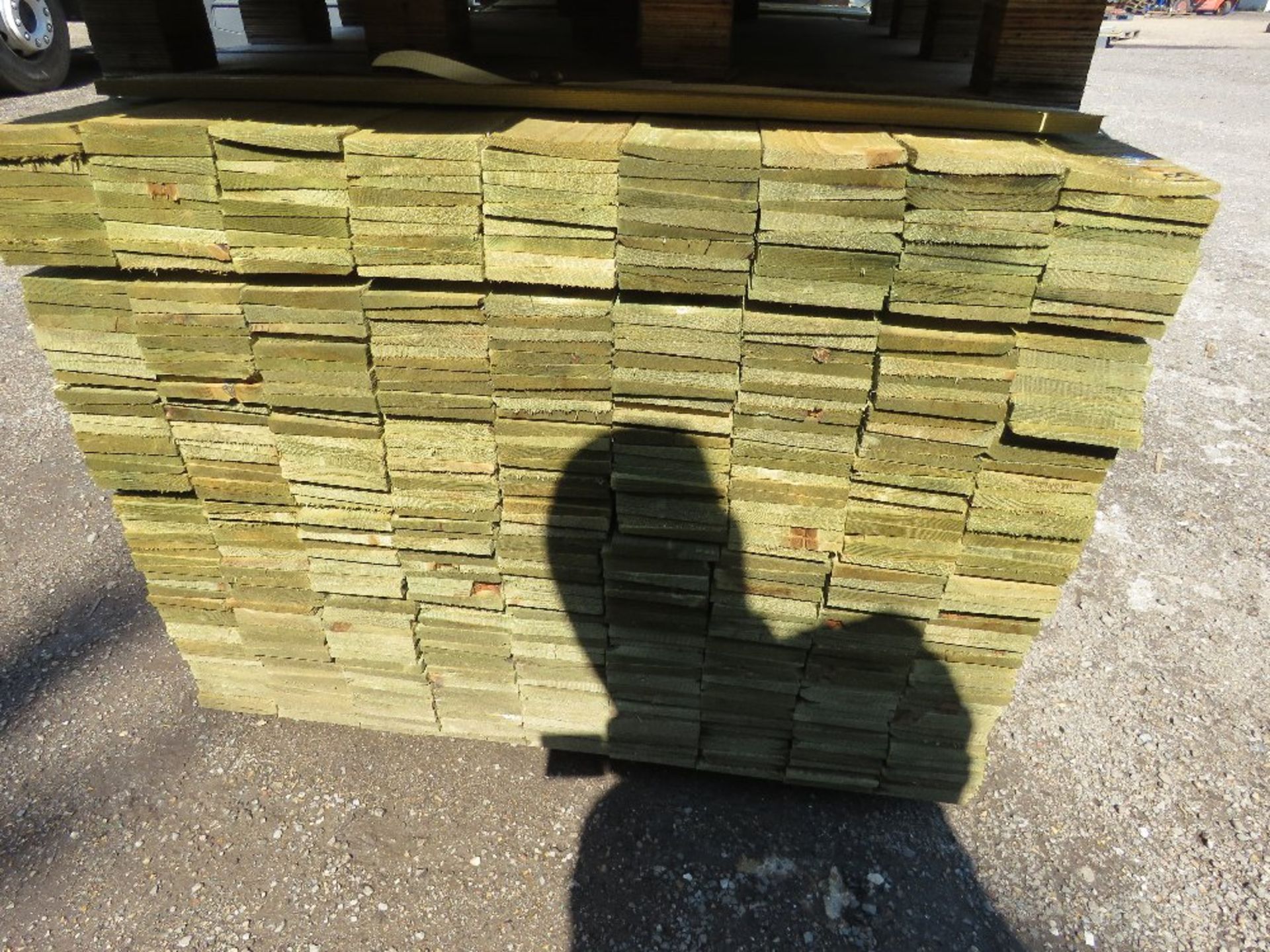 LARGE PACK OF PRESSURE TREATED FEATHER EDGE CLADDING TIMBER BOARDS 1.8M LENGTH X 100MM WIDTH APPROX. - Image 2 of 3