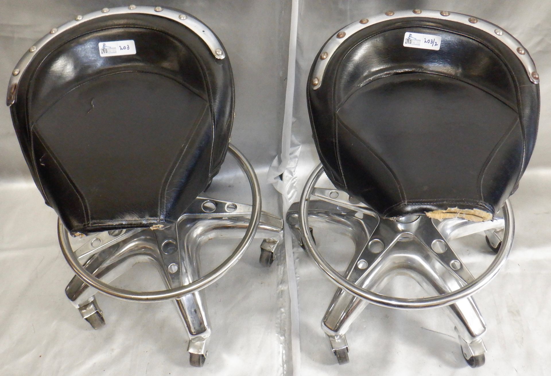 LOT OF 2 SADDLE ROLLING STOOLS