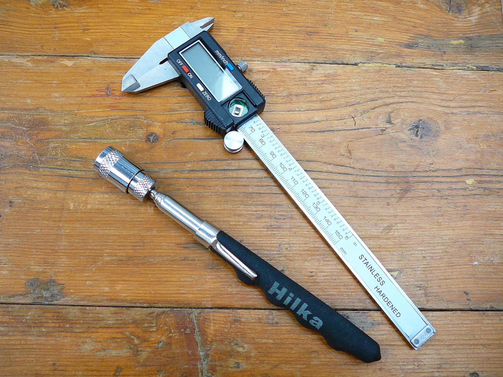 Calipers and magnetic pick up stick