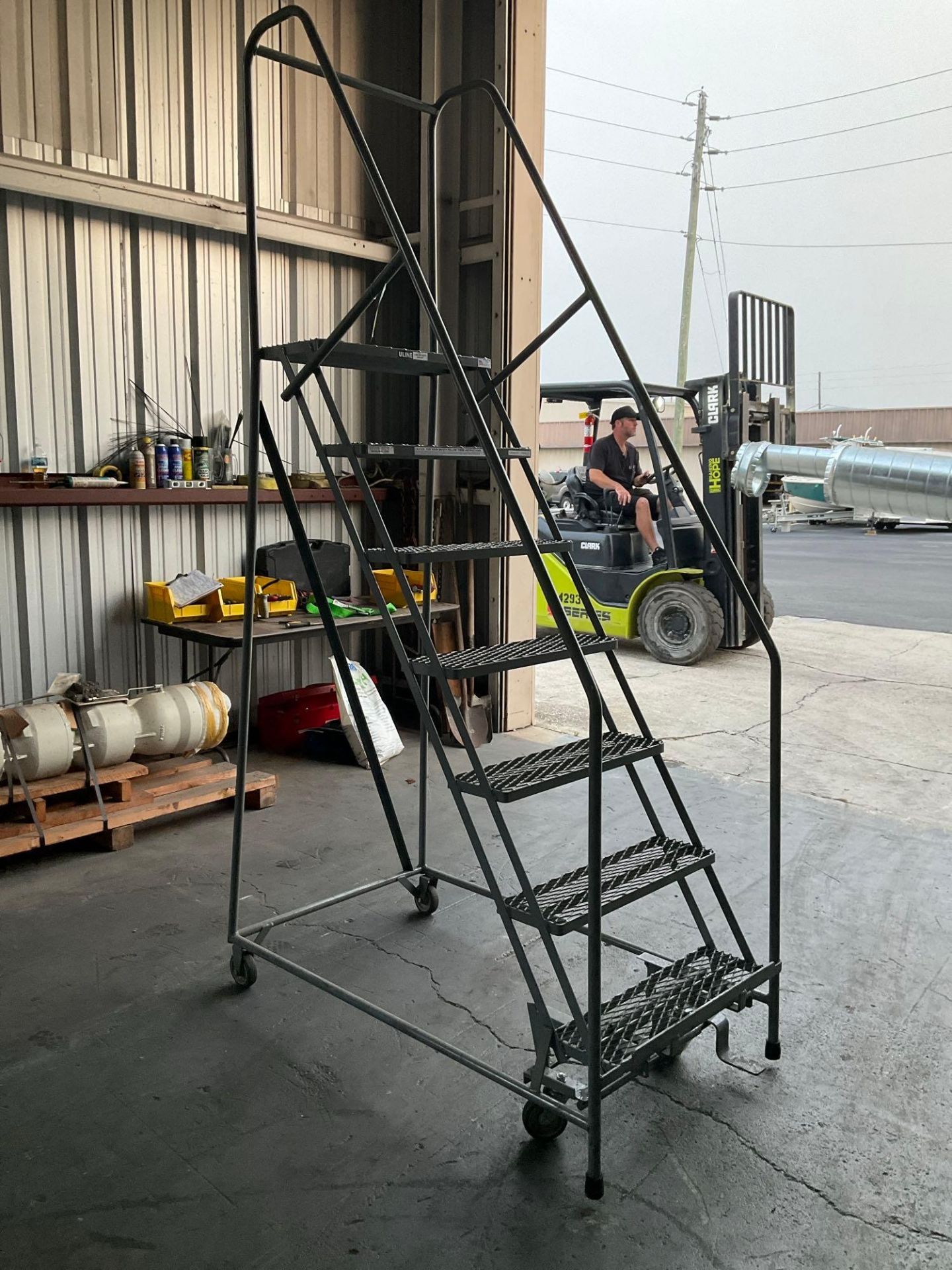 ULINE...SAFETY LADDER WITH WHEELS , APPROX 100? T