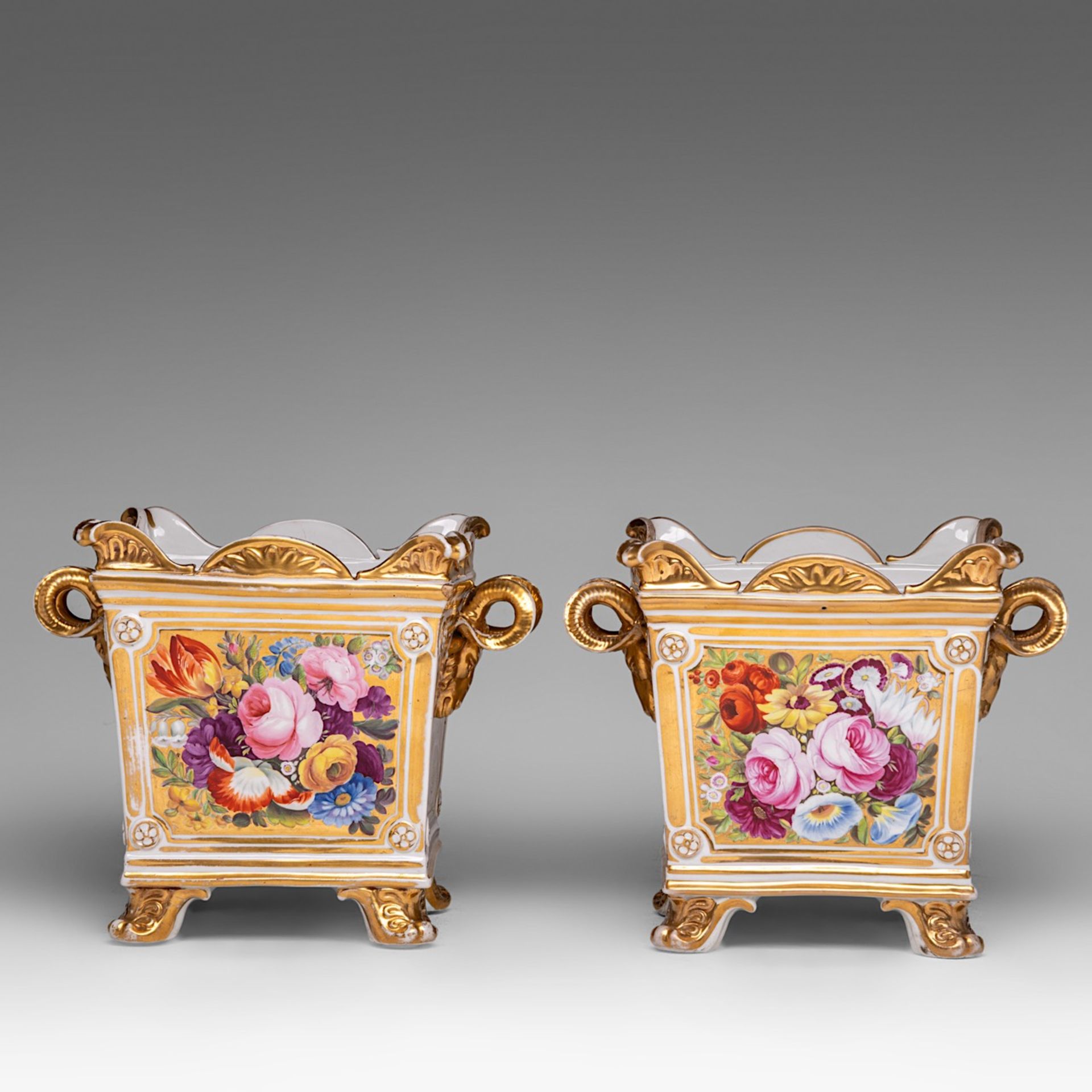 A pair of hand-painted and gilt-decorated porcelain jardinieres with landscapes and flowers, 19thC, - Bild 4 aus 7