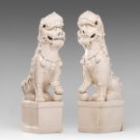 A pair of large Chinese blanc-de-chine figures of Buddhist lions, late Qing, H 45,5 - 49 cm