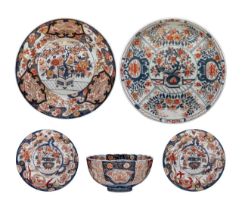 A collection of Japanese Imari ware, all decorated with a flower basket, Meiji period, largest dia 3