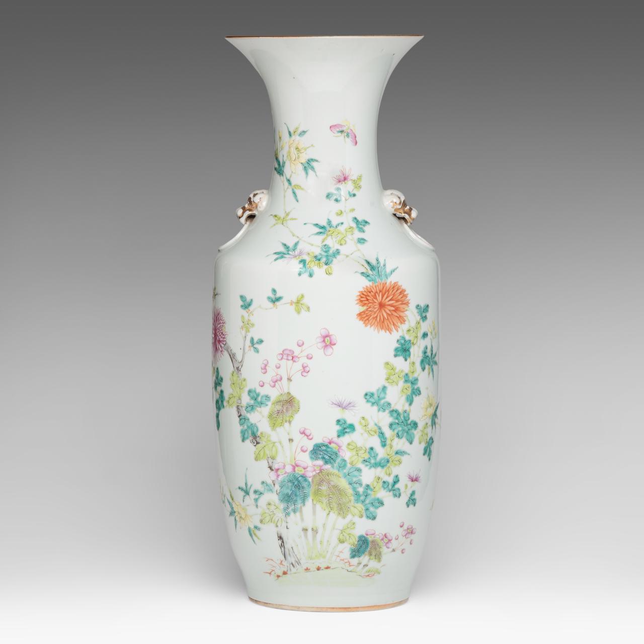 A Chinese famille rose 'Flower garden' vase, paired with lion head handles, late 19thC, H 57,8 cm