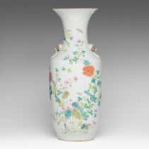 A Chinese famille rose 'Flower garden' vase, paired with lion head handles, late 19thC, H 57,8 cm
