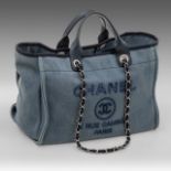 A Chanel Deauville blue denim tote bag with silver-tone hardware, H 26 - W 39 - D 23 cm