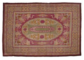 A large woollen Savonnerie rug, marked L. Leveugle Tournai, 406/406 x 512/516 cm