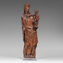 An exceptional walnut Madonna and Child, with traces of polychrome paint, 14thC, H 84 cm