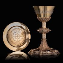 An exquisite Gothic Revival 900/000 silver and gilt silver chalice, its matching paten, and ditto sp