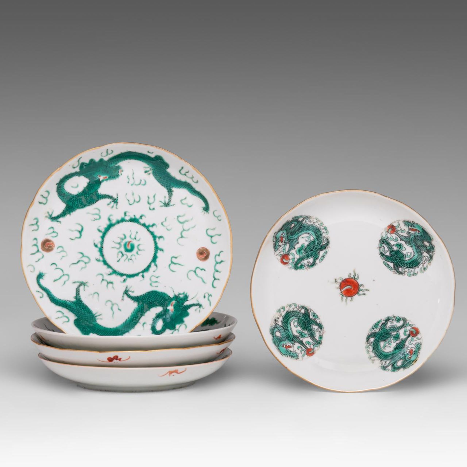 A collection of five Chinese green enamelled 'Dragon' dishes, Daoguang period and some marked, dia 1