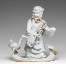 A Chinese blanc-de-Chine group of an Immortal and a crane, 18thC, H 21,8 cm