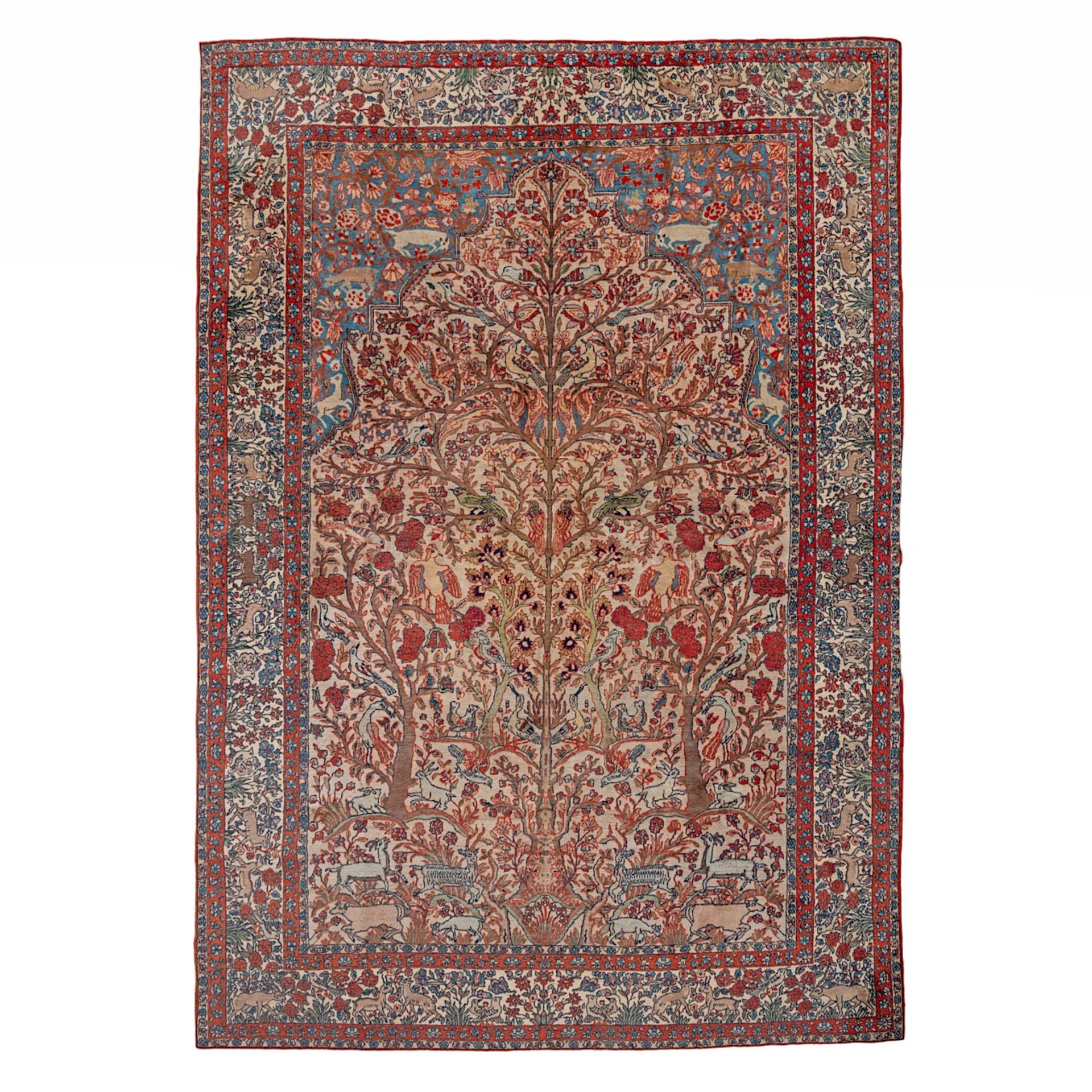 An Oriental woollen rug, decorated with the tree of life and paradise scenery, 297 x 216 cm