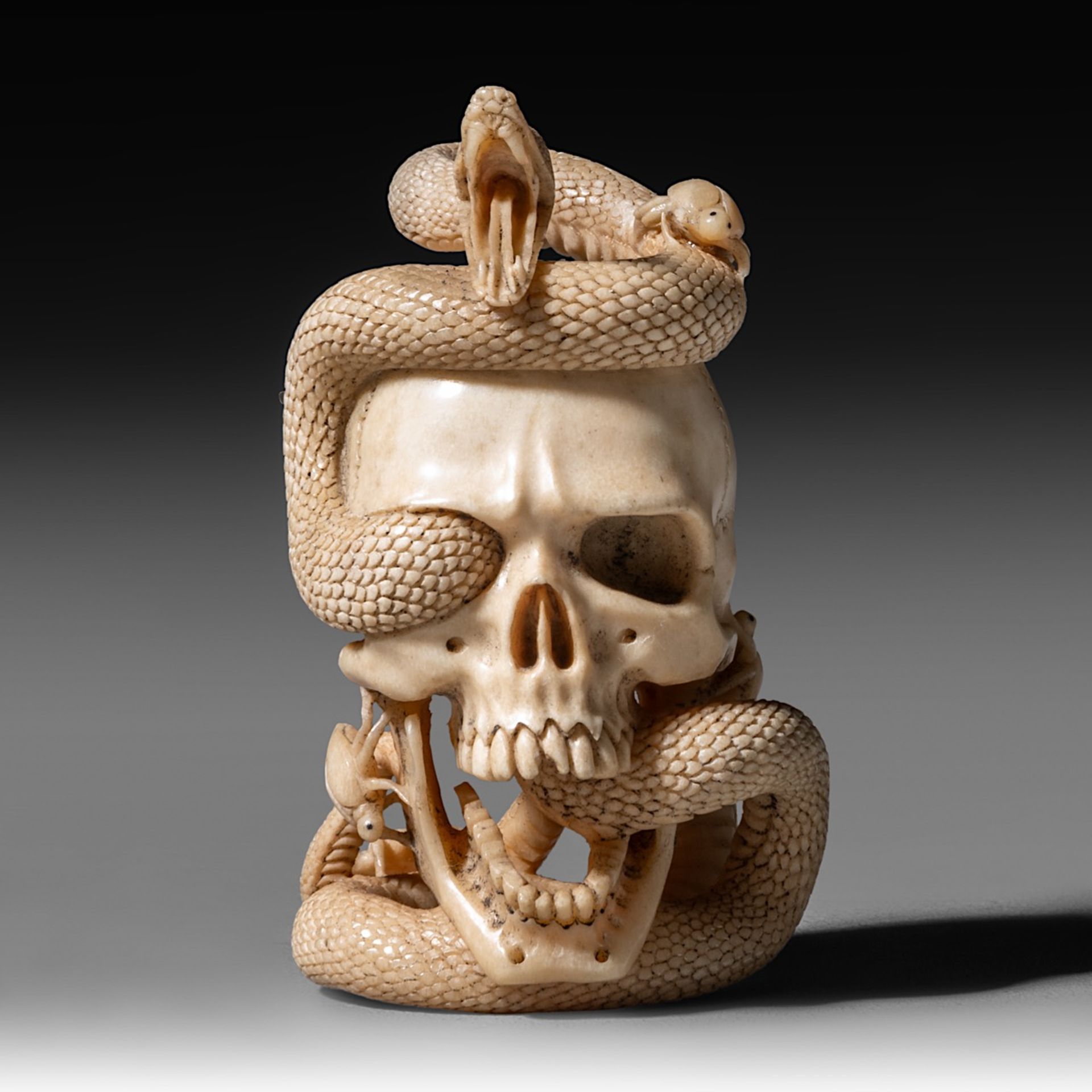 A (German) skull and snake sculpture, bone, 18th - 19th century, H 7,9 cm - weight 79 g