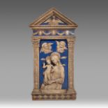 A blue and white glazed terracotta relief of the Virgin and Child in the Della Robbia manner or a fo