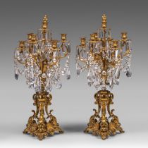 A pair of Napoleon III gilt bronze and crystal cut girandoles, H 82 cm